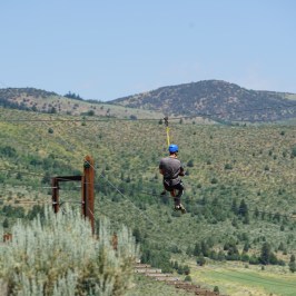 Zipliner enjoying the views of Lava Hot Springs from above