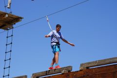 boy balancing on the high ropes course in Lava Zipline Adventure
