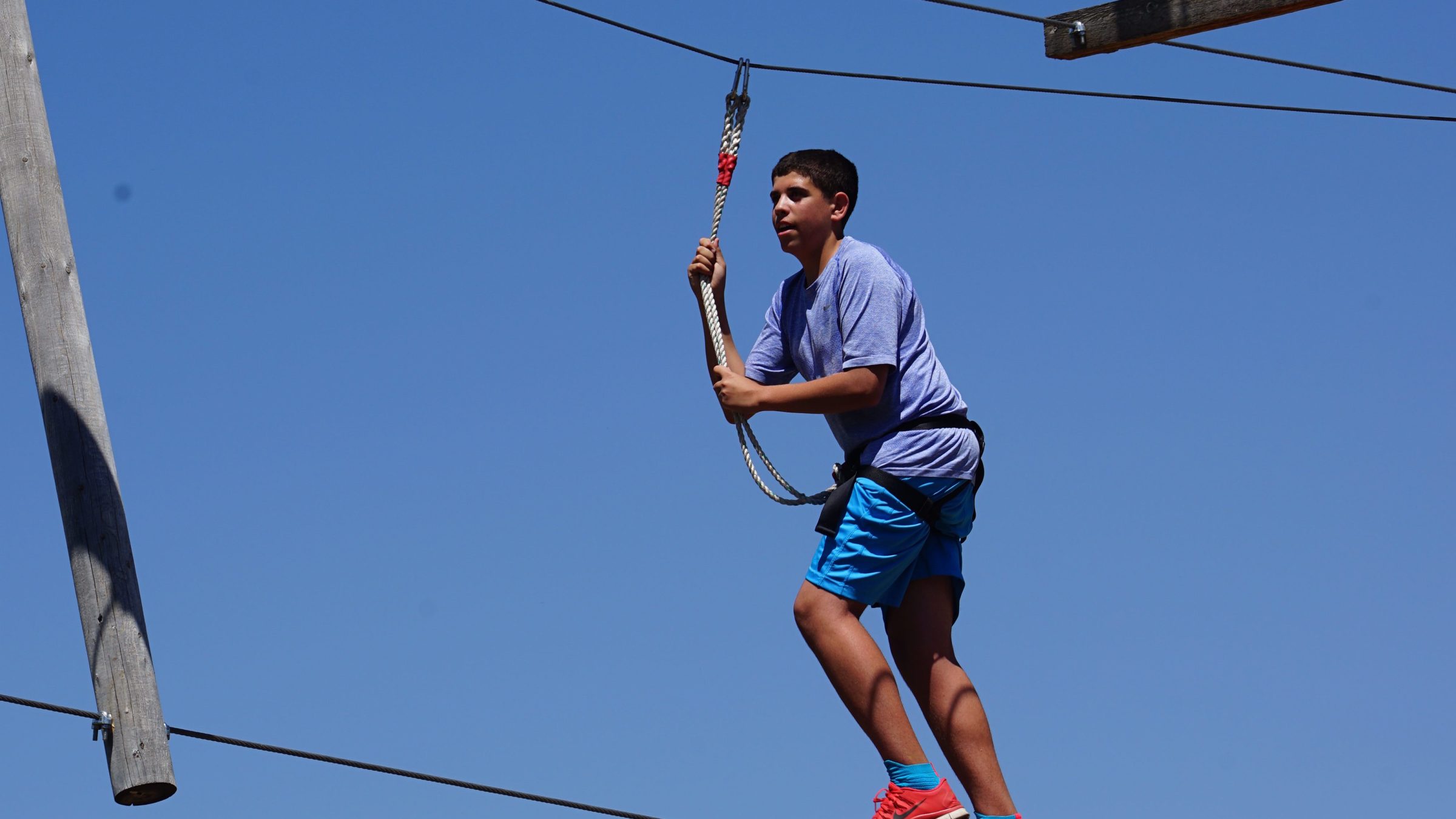 Boy enjoying the high ropes course