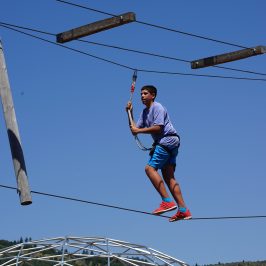 Boy enjoying the high ropes course