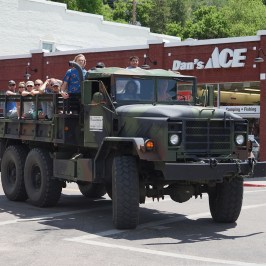 riding in the army truck to the Lava Zipline Adventure park