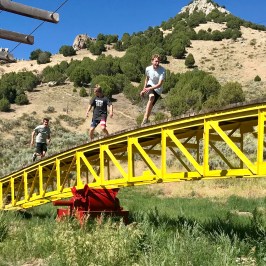boy chasing friends across giant teeder todder