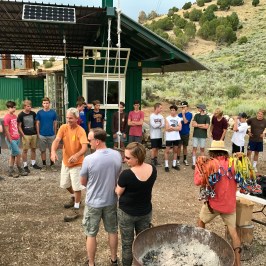 large group learning the rules of the zipline courses