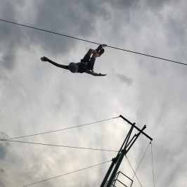 birds-eye view of zip-liner hanging upside down