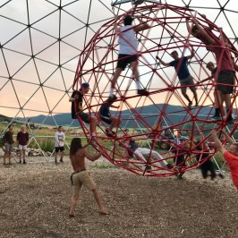 group playing inside the geodesic dome